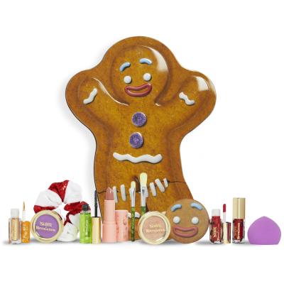 Makeup Revolution London Shrek Gingy 12 Days Advent Calendar Poklon set sjenilo 2 kom + highlighter 1 kom + sjajilo za usne 2 kom + ruž 1 kom + rumenilo 1 kom + gel za obrve 1 kom + kist 2 kom + spužvica za šminkanje 1 kom + ogledalo 1 kom + gumica za kosu 1 kom